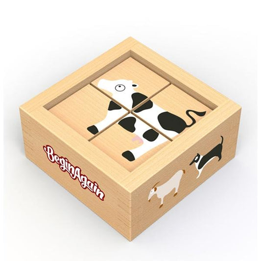 Wooden box holds wooden blocks that, together, form a picture of a cow.