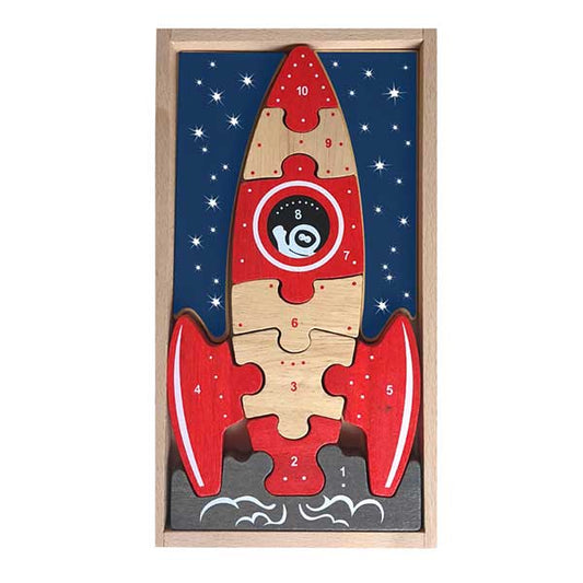 Red and tan wooden rocket puzzle with night sky background