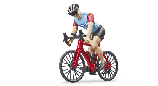 Figure of a man with jointed knees and elbows on a red bicycle