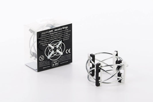 Moveable, metal rings sit stacked outside of box