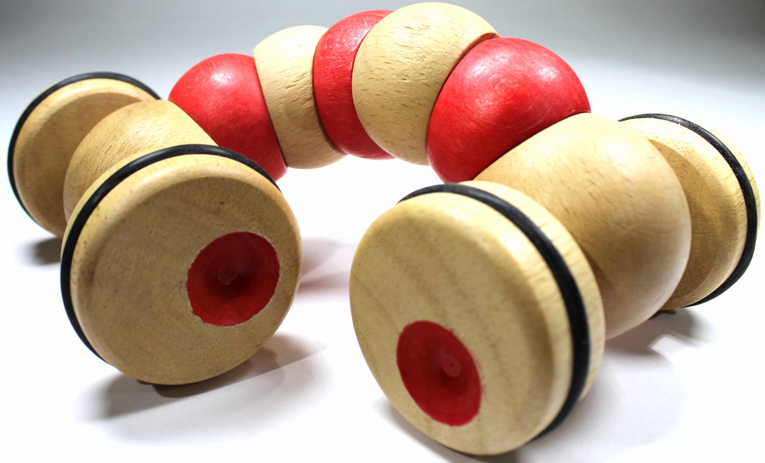 Jointed red and natural wooden "worm" with four wheels