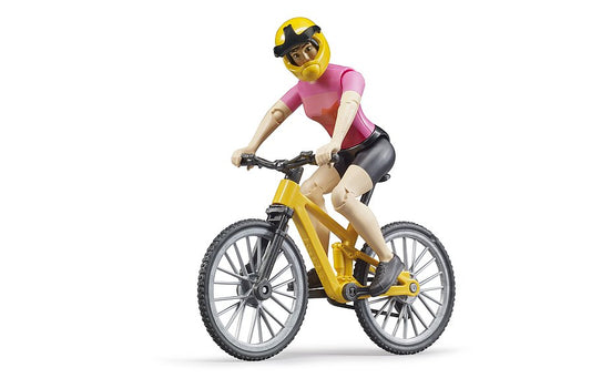 Woman in pink biker shirt and yellow helmet rides yellow and black bicycle